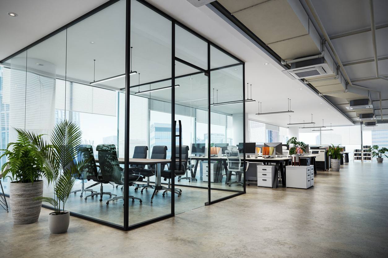 Office interior with a plant, representing the commercial buildings FM companies manage in Surrey