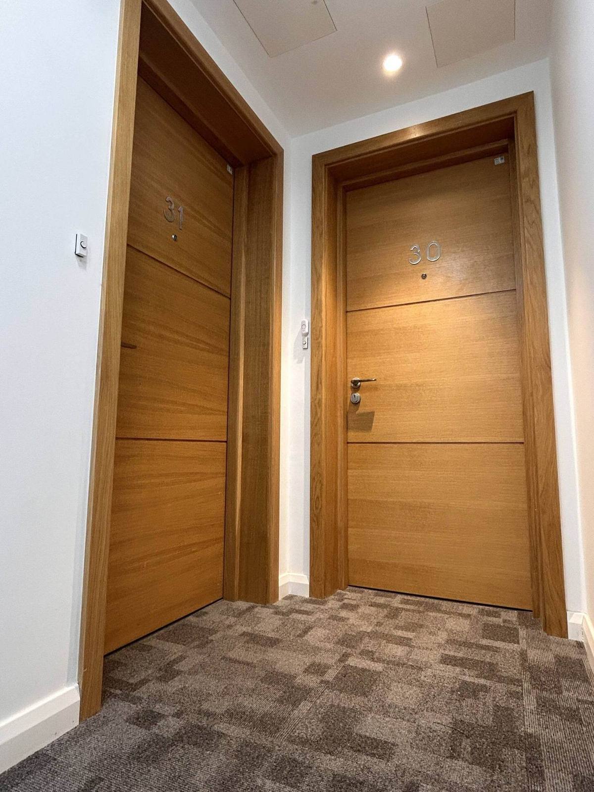 Certified fire doors in an apartment block corridor